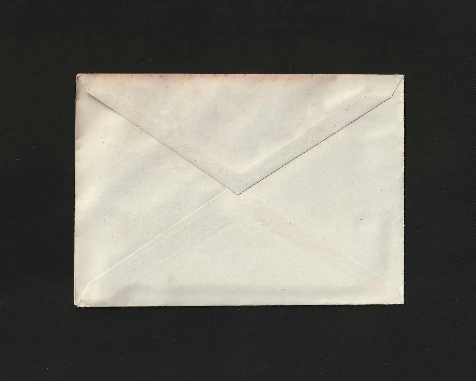 Unopened envelope on a dark background