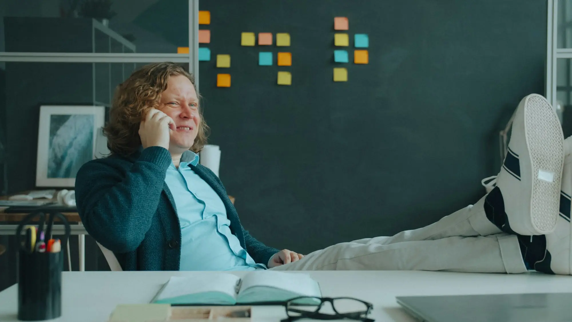 Business owner making a phone call at her desk