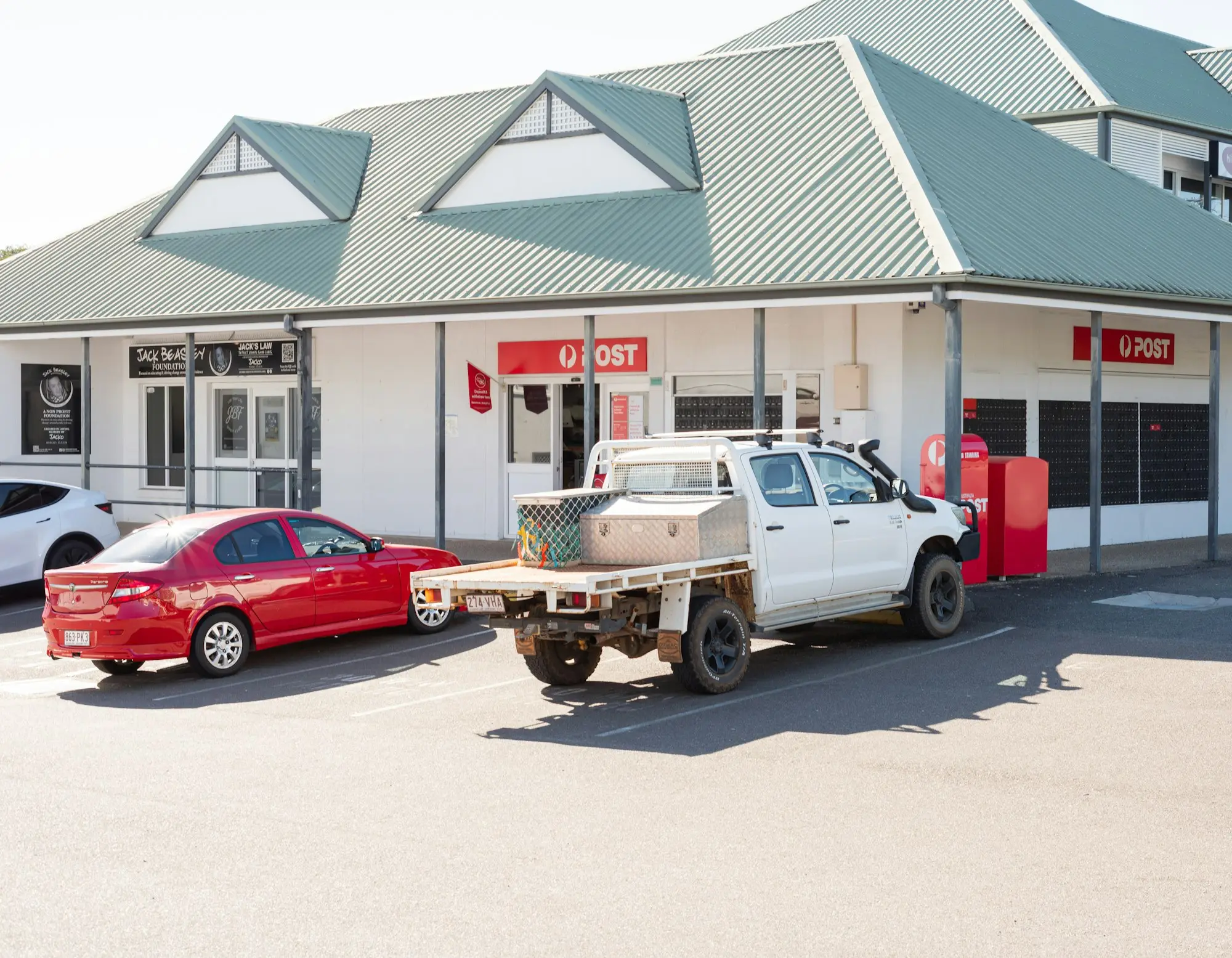 Tradie's ute parked outside shops on the Gold Coast